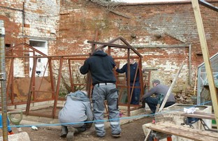 Reconstructing the donated cedar greenhouse