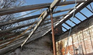 The peach house roof before covering with the protective tarpaulin